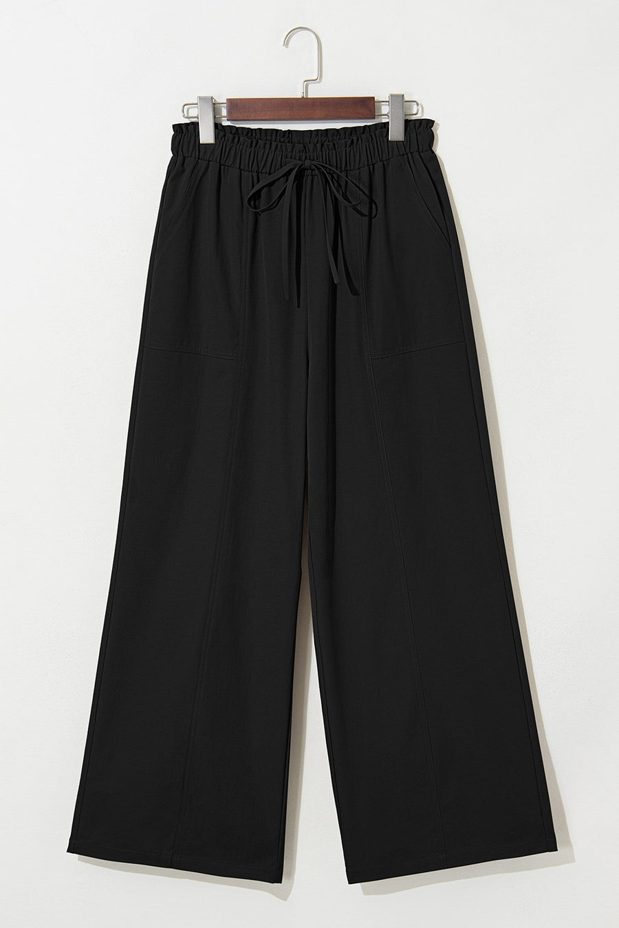 Black cropped pants with drawstring elastic waist and wide legs.