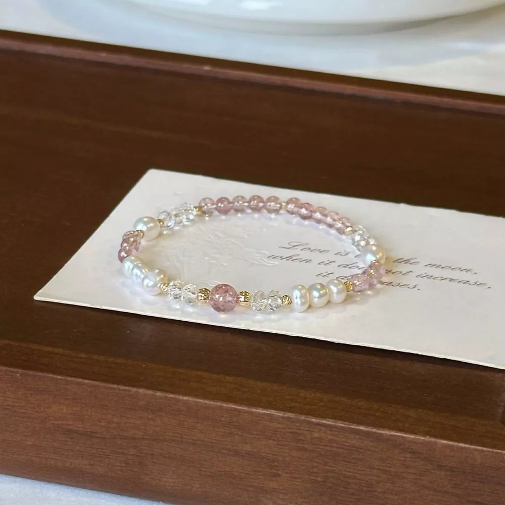 Lustrous pearl and crystal elegance bracelet with pink beads and gold accents