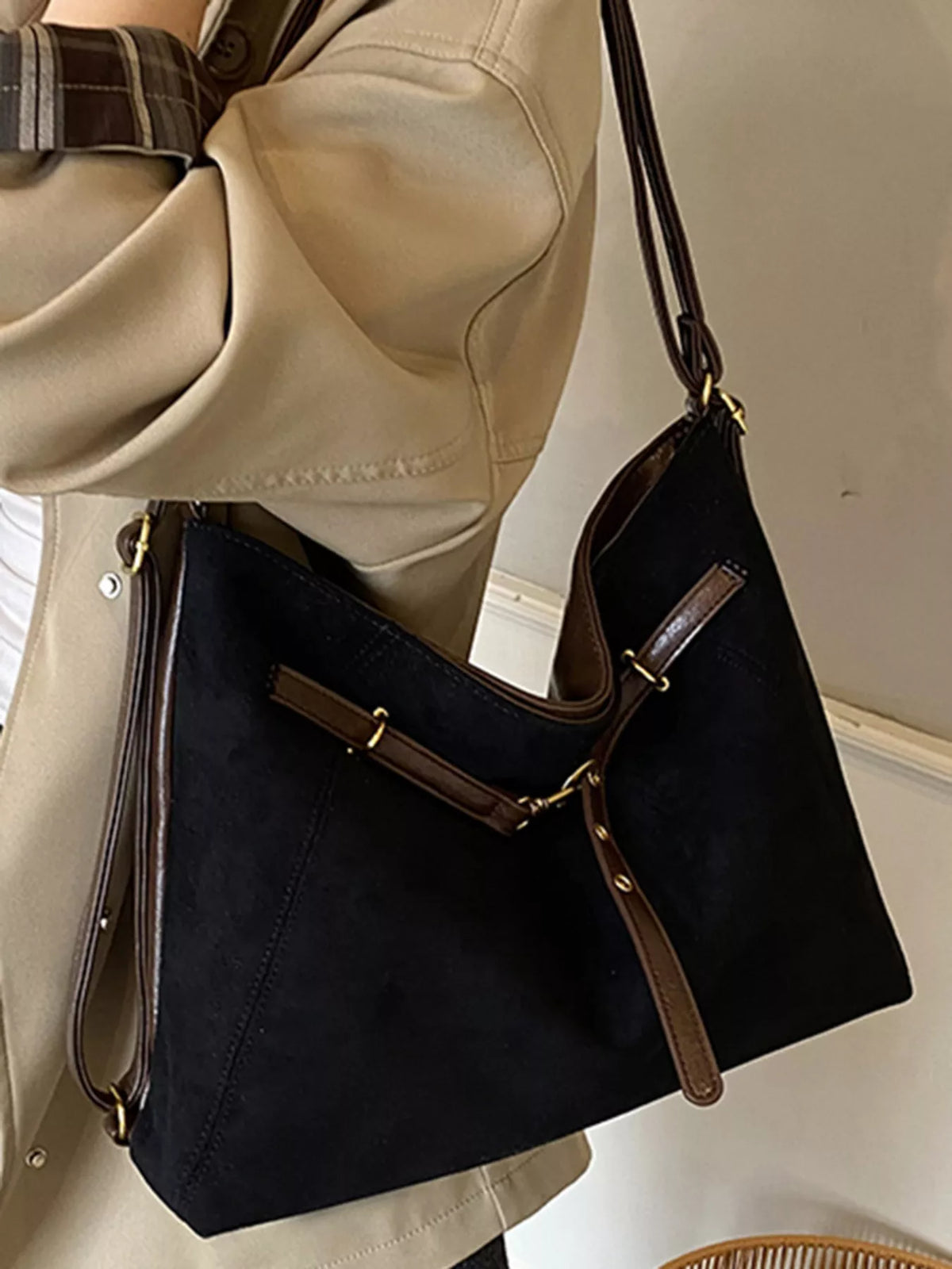 Black suede large tote bag with brown trim and strap detail