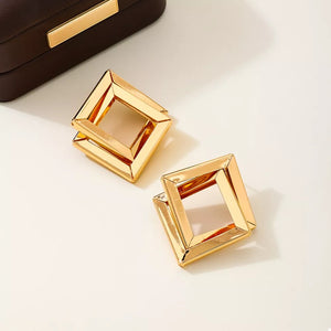 18K Gold-Plated,Alloy,Stainless Steel Care instructions: Avoid wearing during ex earrings in gold with geometric silhouette