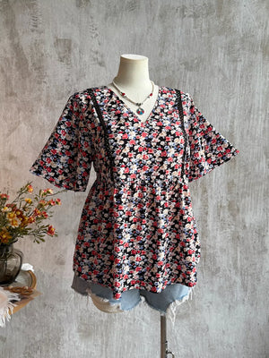 Black floral v-neck blouse with lace detail and short sleeves