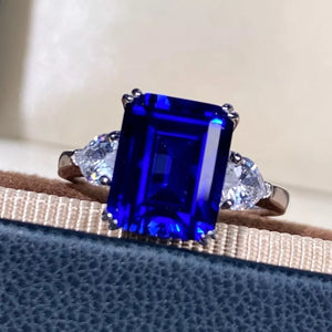 ring in Royal Blue with geometric and three-stone setting