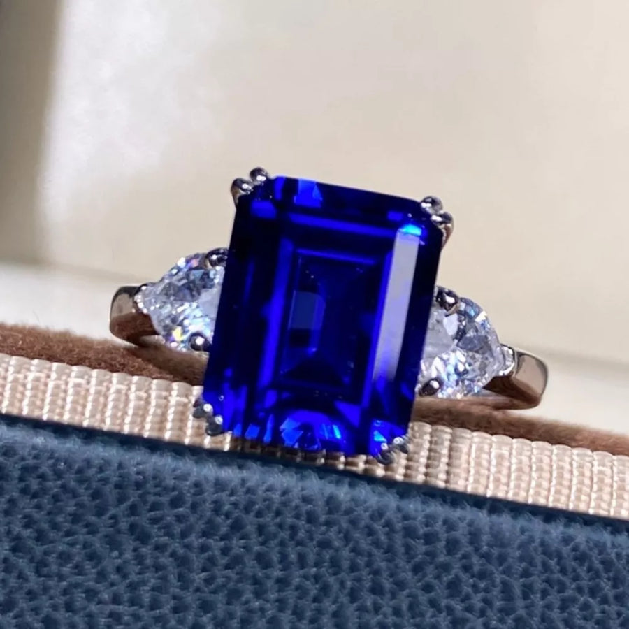 ring in Royal Blue with geometric and three-stone setting