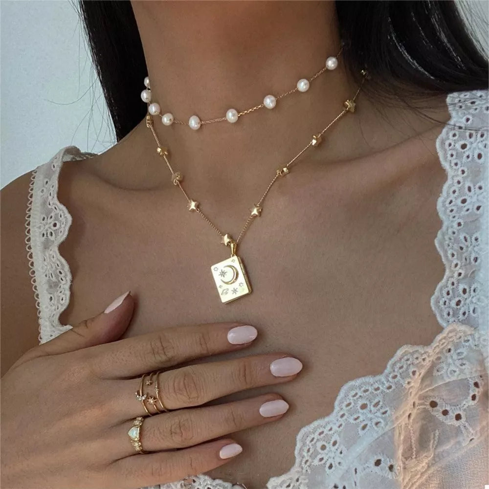 gold necklace with celestial and N/A