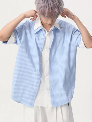 Blue striped short sleeve button-up shirt with white collar and inner shirt