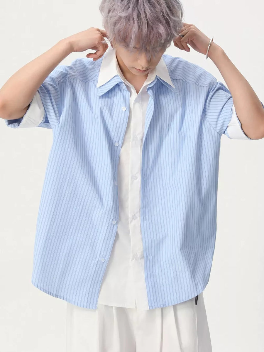 Blue striped short sleeve button-up shirt with white collar and inner shirt