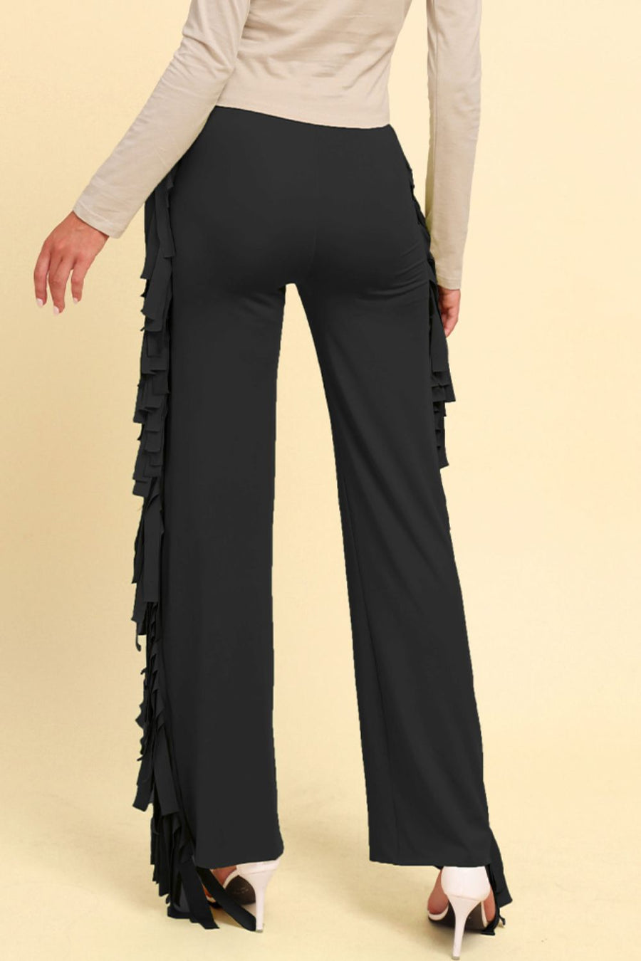 Black palazzo trousers with cascading fringe detail on the side.