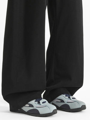 Men's black wide-leg casual pants with a relaxed fit.