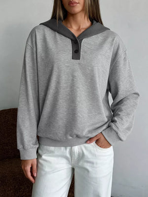 pullover hoodie in light grey featuring buttoned and relaxed fit