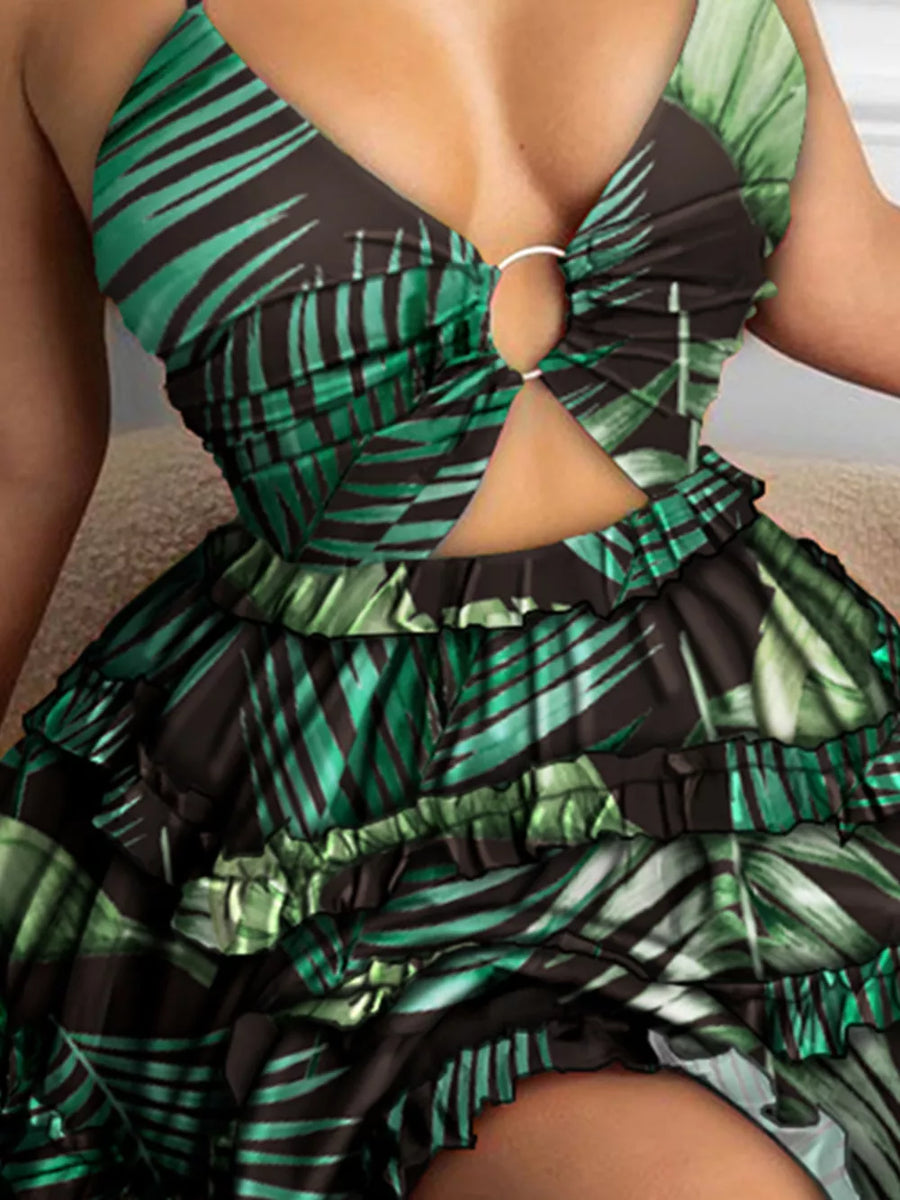 Halter mini dress in dark green abstract leaf print with cutout and ruffled tiers.