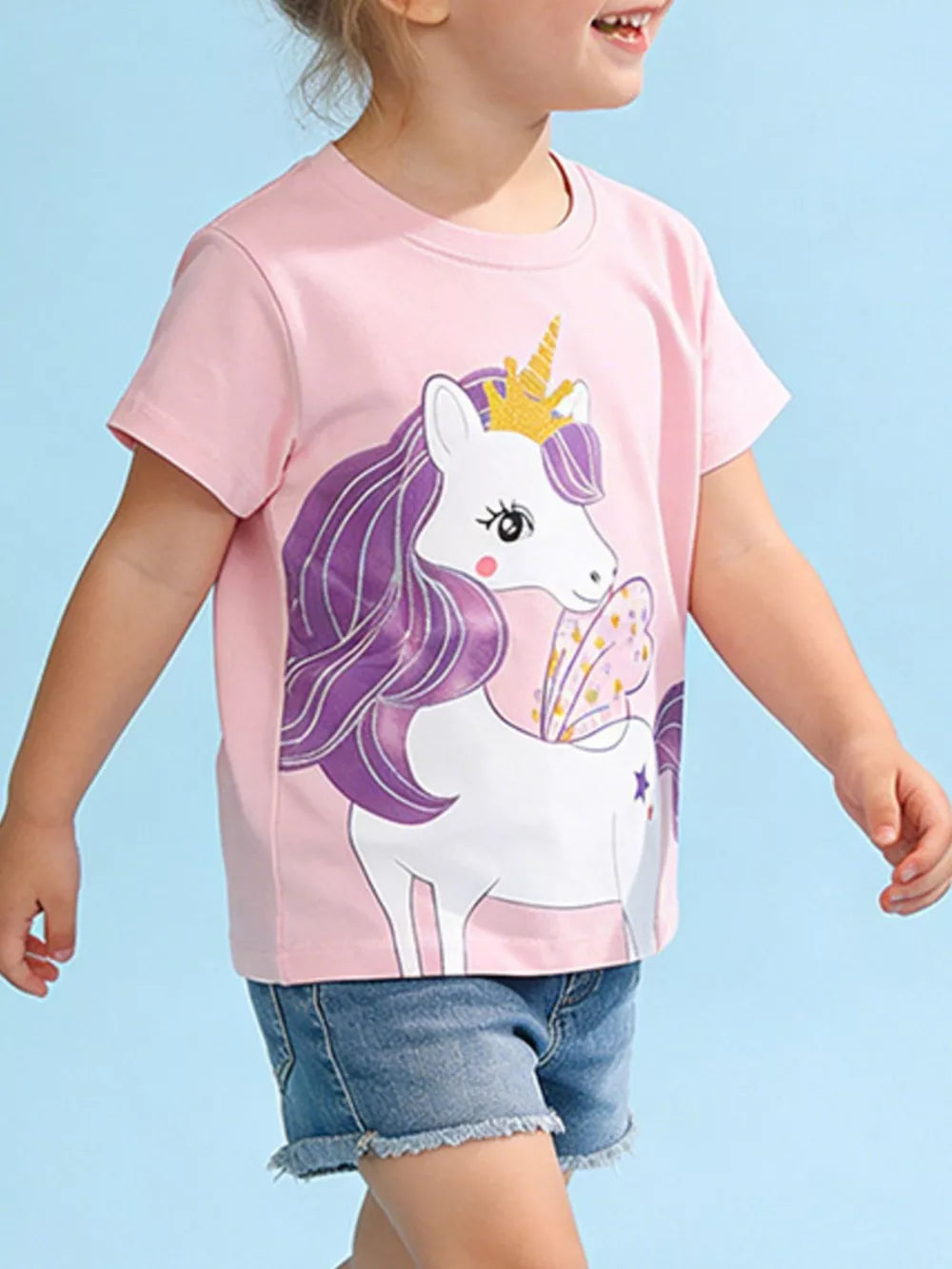 Pink cotton toddler t-shirt with a graphic of a unicorn wearing a crown and wings.