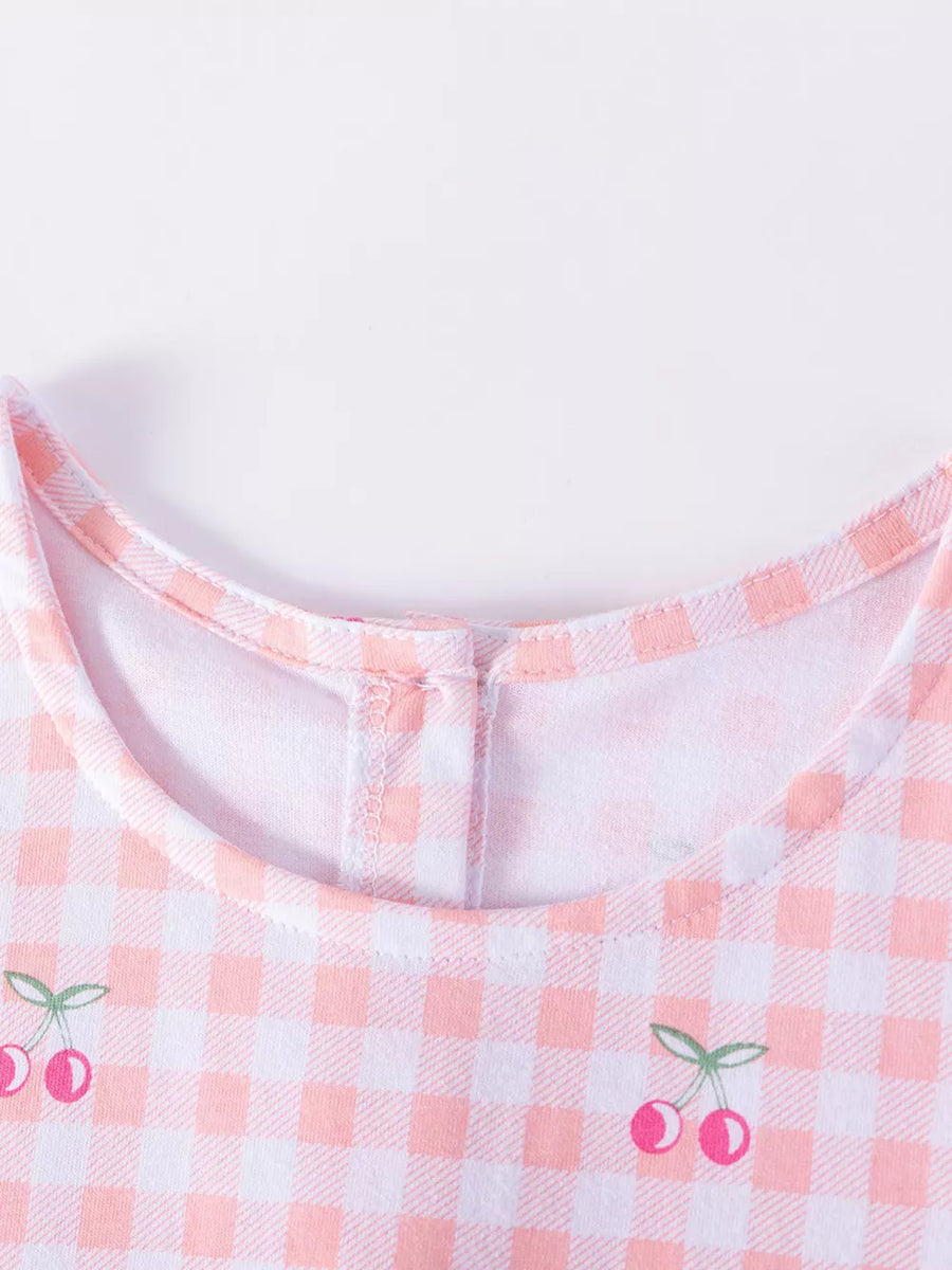 Baby dress with pink gingham and cherry embroidery, cotton fabric.