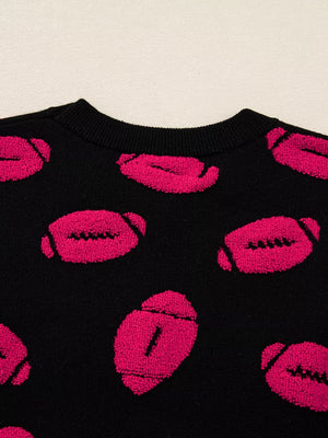 Black short-sleeve sweater with a playful all-over pink football pattern.