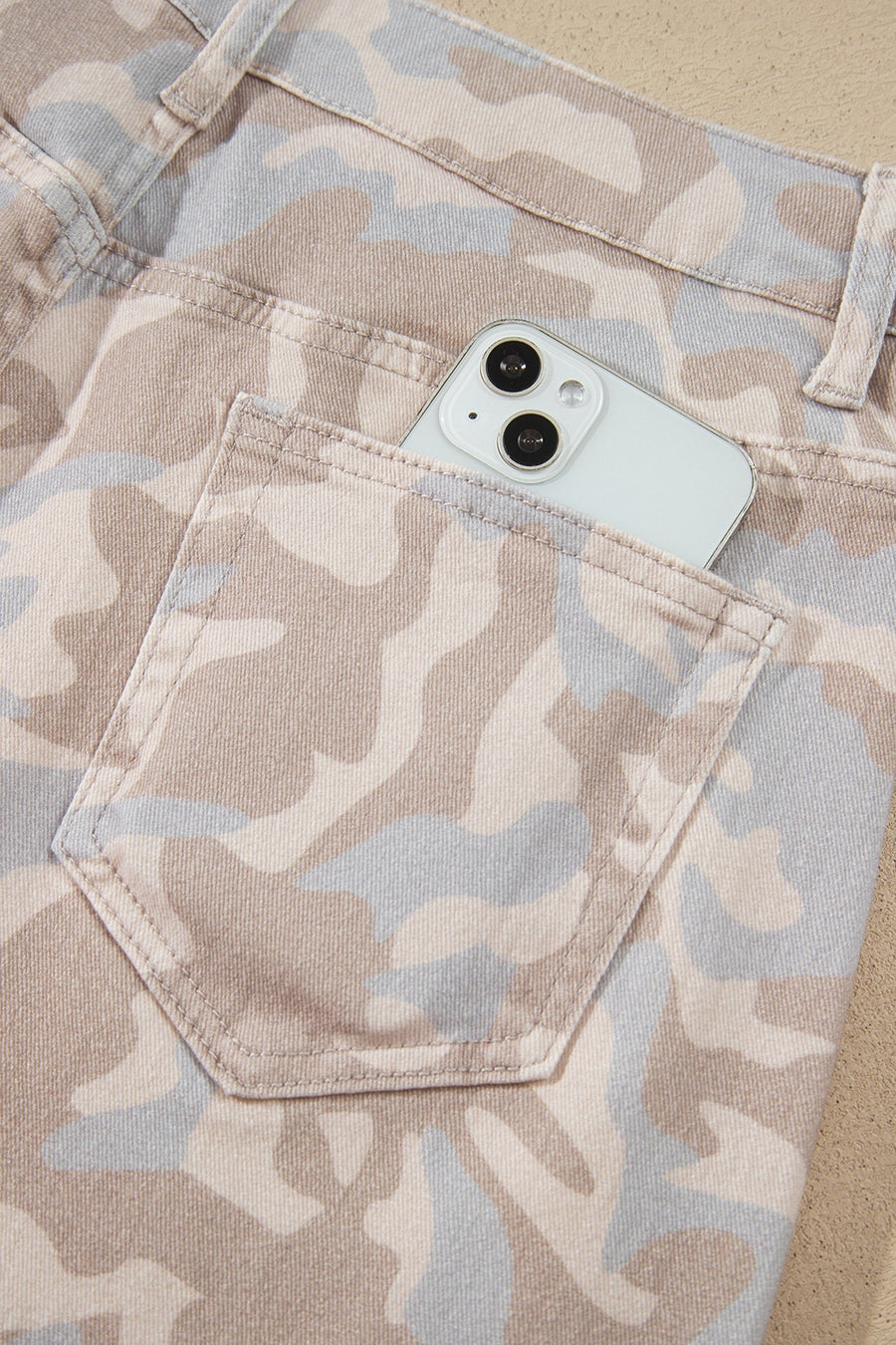 light beige jeans featuring pocketed and camo
