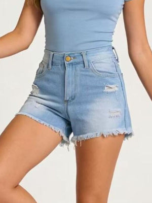 Light blue distressed denim shorts with frayed hem and button closure.