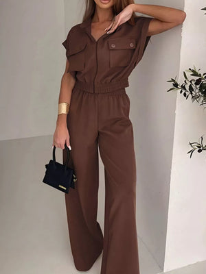 Brown zip-front collared short-sleeve cropped jumpsuit with elastic waist and wide-leg pants.