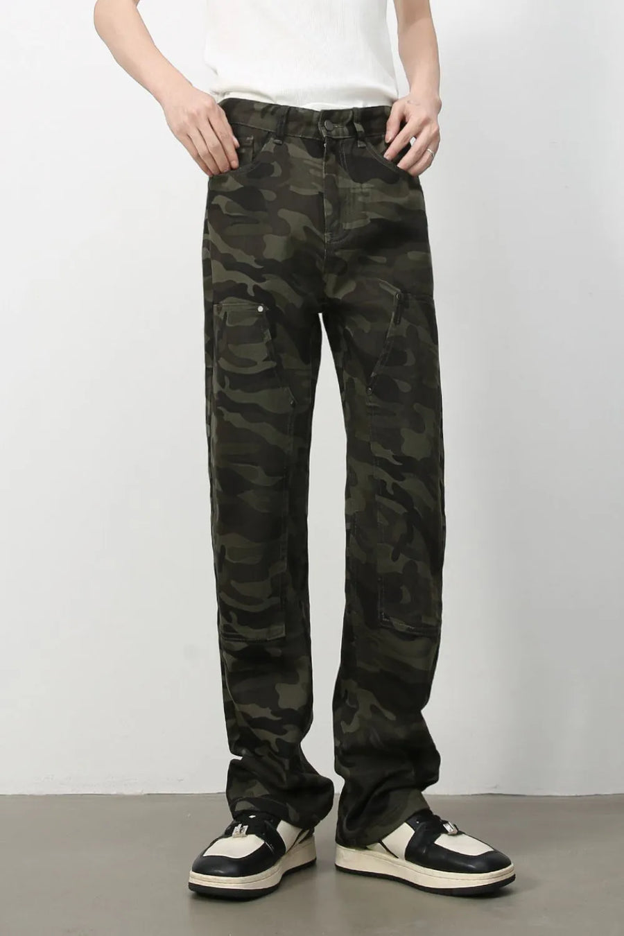 Utility camo carpenter jeans in black with multiple cargo pockets.