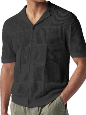 Black geometric knit polo shirt with button front and spread collar.