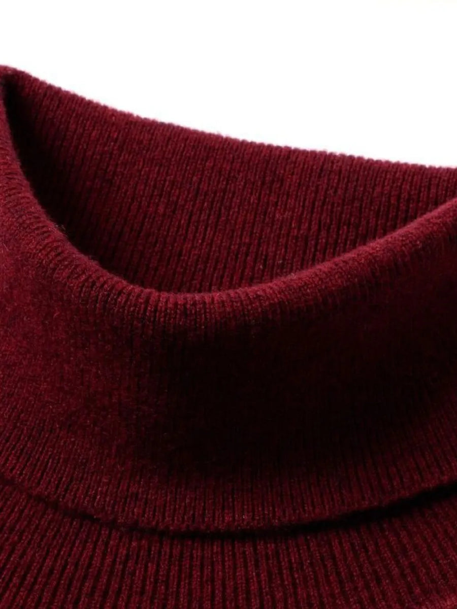 Deep Red turtleneck sweater with ribbed texture and a folded collar.