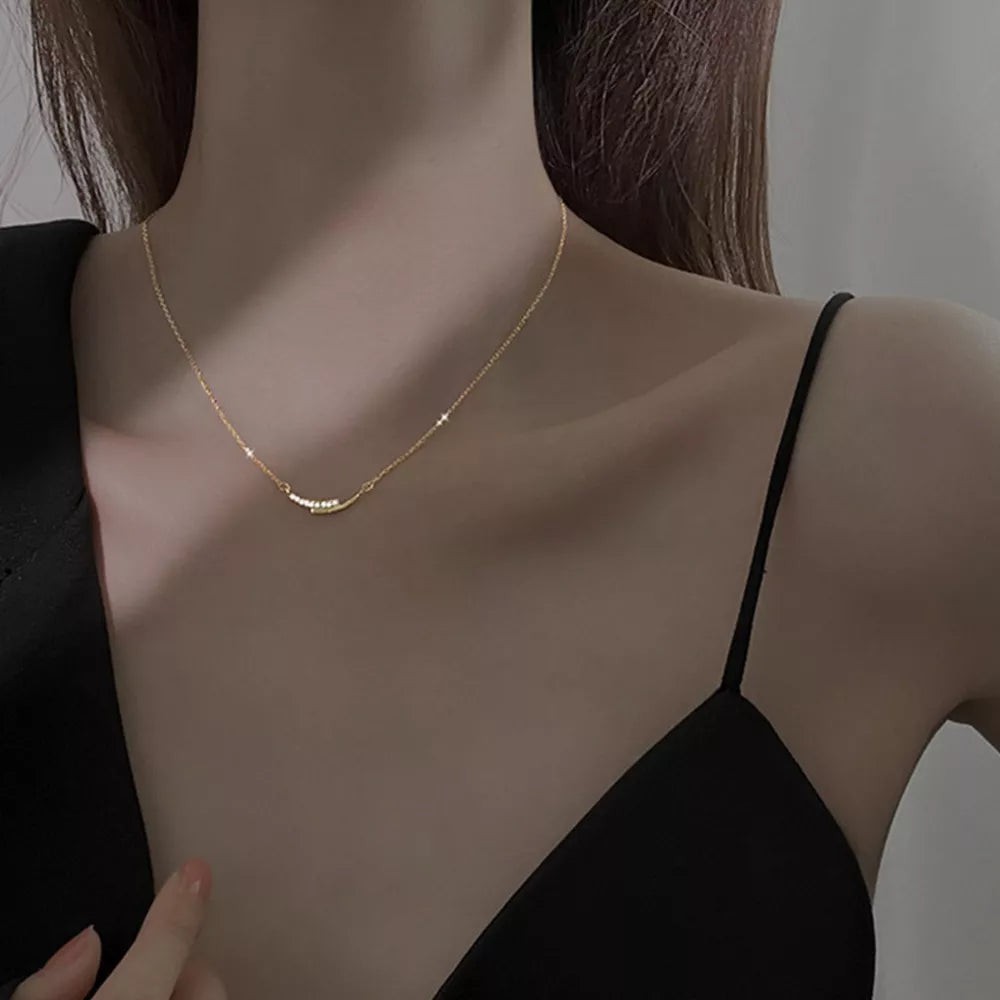 necklace in gold featuring rhinestone embellishment and delicate fit