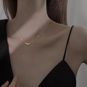 necklace in gold featuring rhinestone embellishment and delicate fit