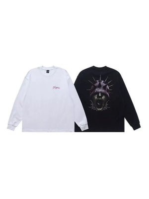 Long sleeve t-shirts, one white with pink text, one black with graphic print.