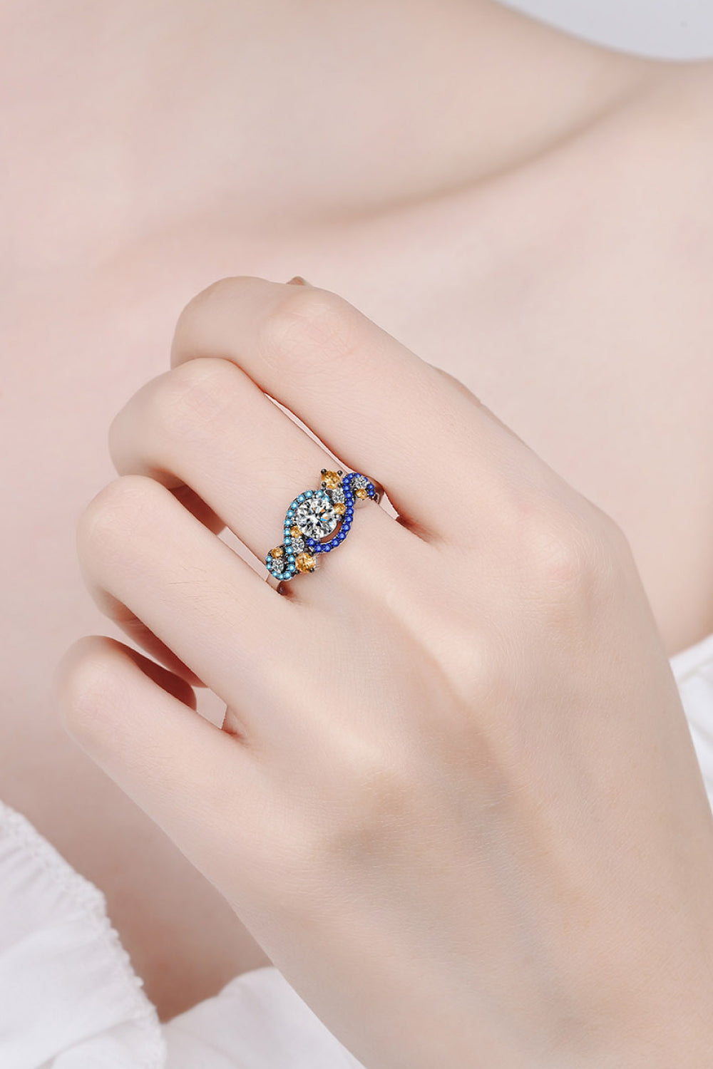 Celestial Swirl Gemstone Ring in silver with blue and yellow accent stones.