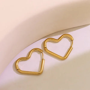 Gold heart huggie earrings made of steel