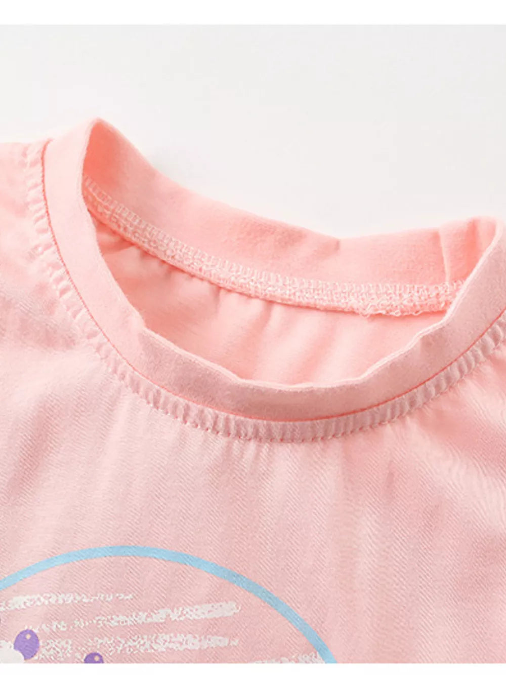 Toddler pink cotton t-shirt with round neckline and graphic detail.