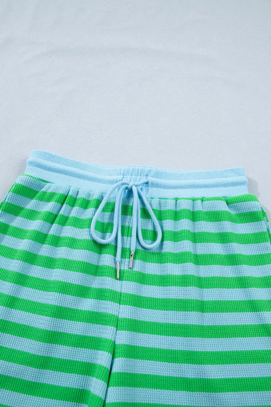 Striped shorts in green and light blue with drawstring waist