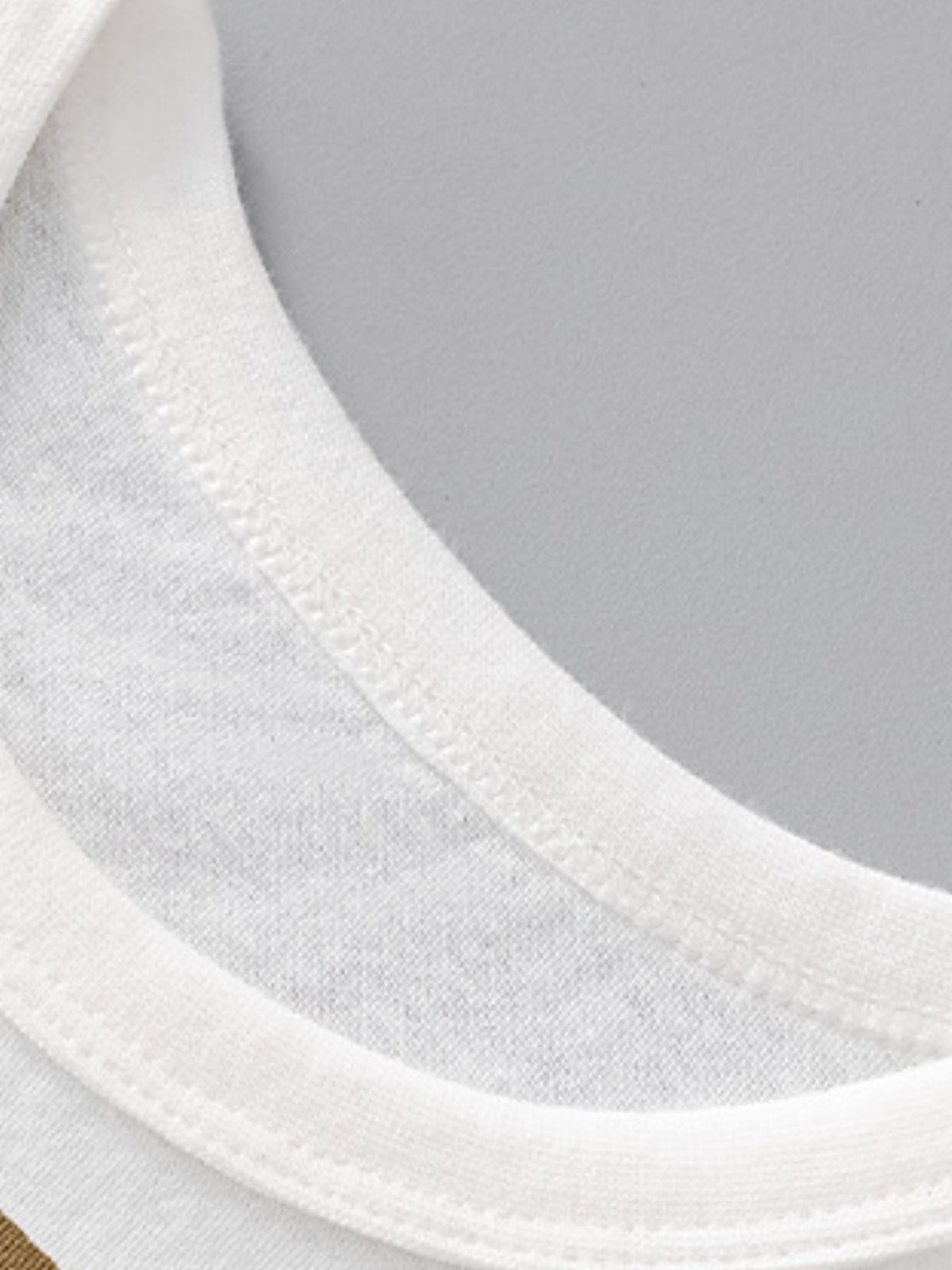 Toddler crew-neck t-shirt detail showing white ribbed collar and stitching