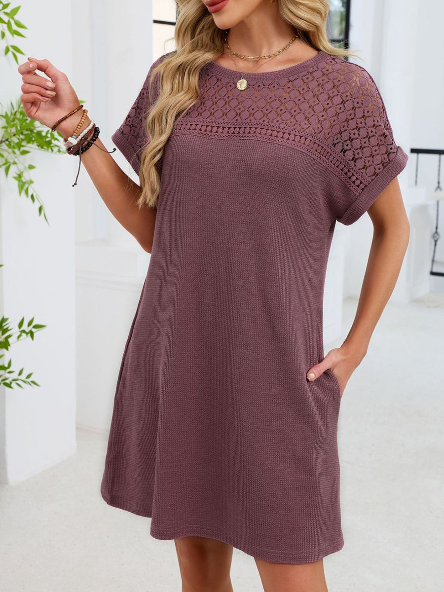 Mauve t-shirt dress with short sleeves and a sheer lace yoke detail.