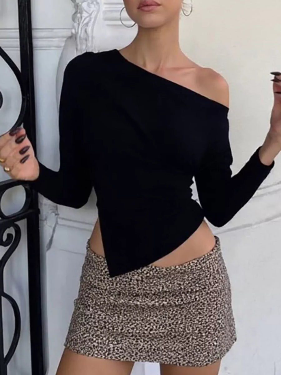 Black draped asymmetrical off-shoulder t-shirt with a long sleeve and a pointed hem.