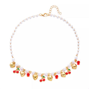necklace in white with motif and pearl embellishment