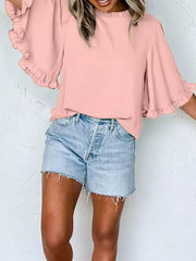 Pink ruffled mock neck half sleeve shirt with bell sleeves.