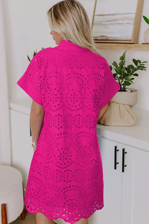 Hot pink cotton eyelet dress with short sleeves and a V-neck, featuring intricate cut-out details.
