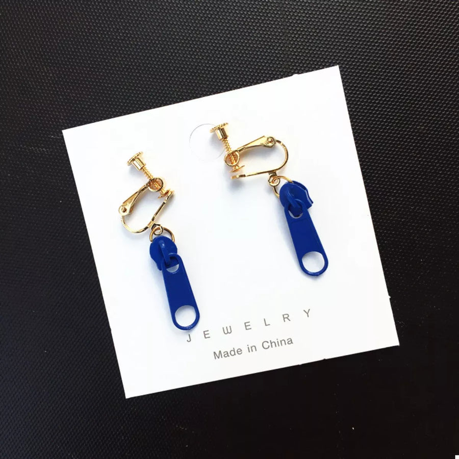 Royal blue zipper dangle clip-on earrings with gold-tone hardware.