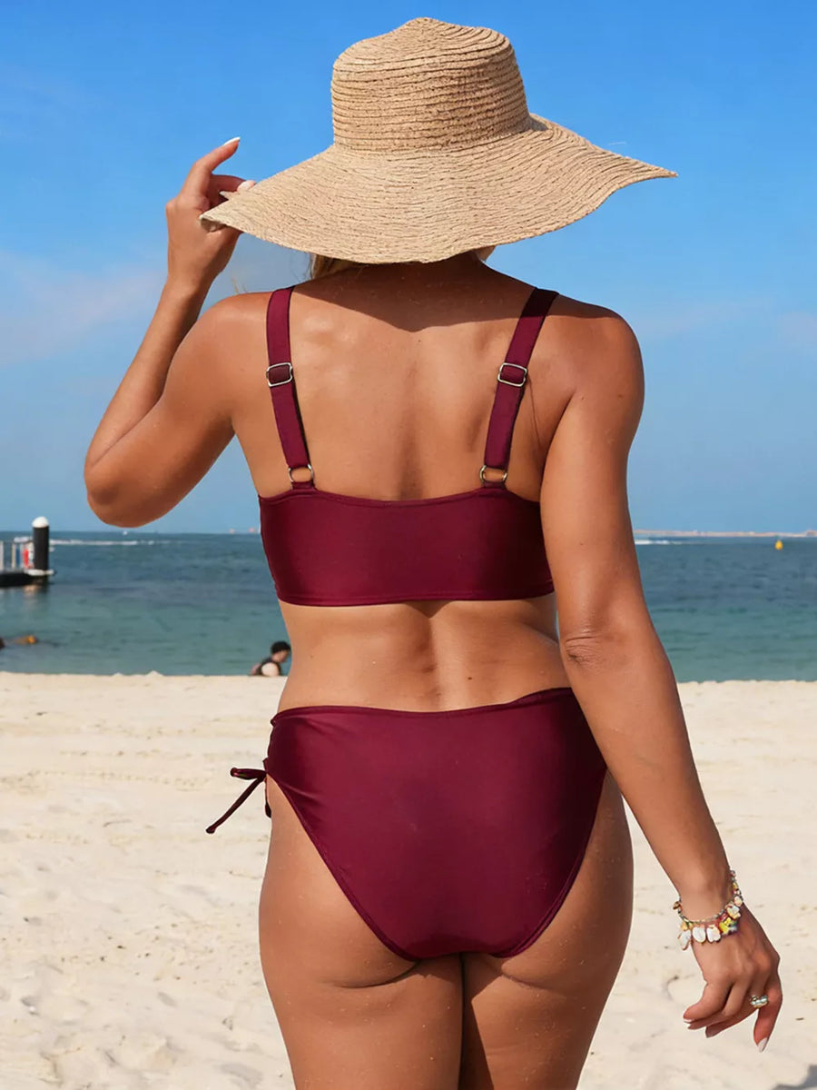 Burgundy palm tree cutout bikini with adjustable straps and tie-side bottoms.