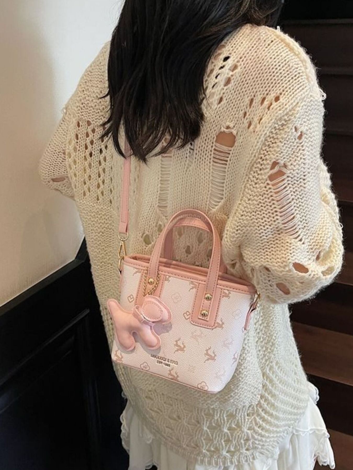 Charming mini crossbody bag in blush pink with deer print and dog charm