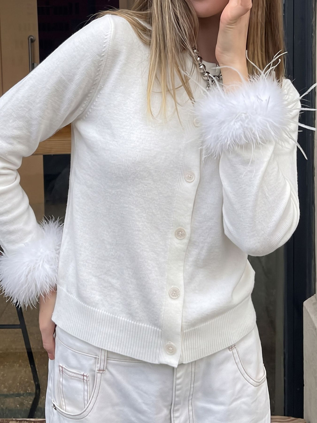 cardigan in white featuring fuzzy cuffs and regular fit