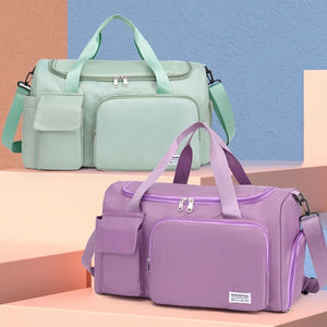 Duffel bag in Heliotrope Purple and Gum Leaf with multiple utility pockets and adjustable strap.