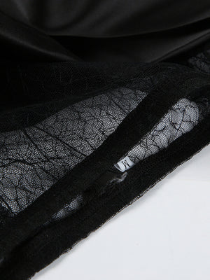 Black midi skirt with sheer lace panel detail and satin fabric.
