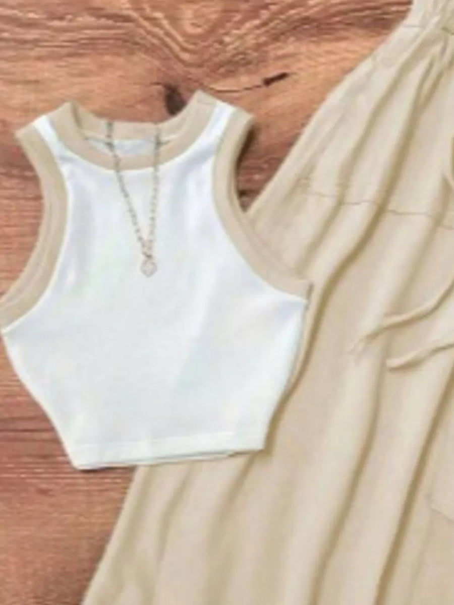 White ribbed tank top with tan trim and a delicate pendant necklace, paired with tan drawstring pants.