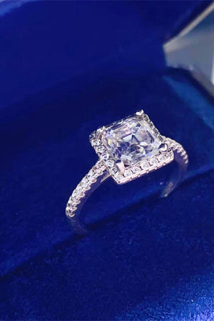 Silver halo ring with asscher cut moissanite center stone and diamond band.