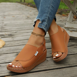 Brown open-toe wedge sandals with white stitching and "Fashion" label.