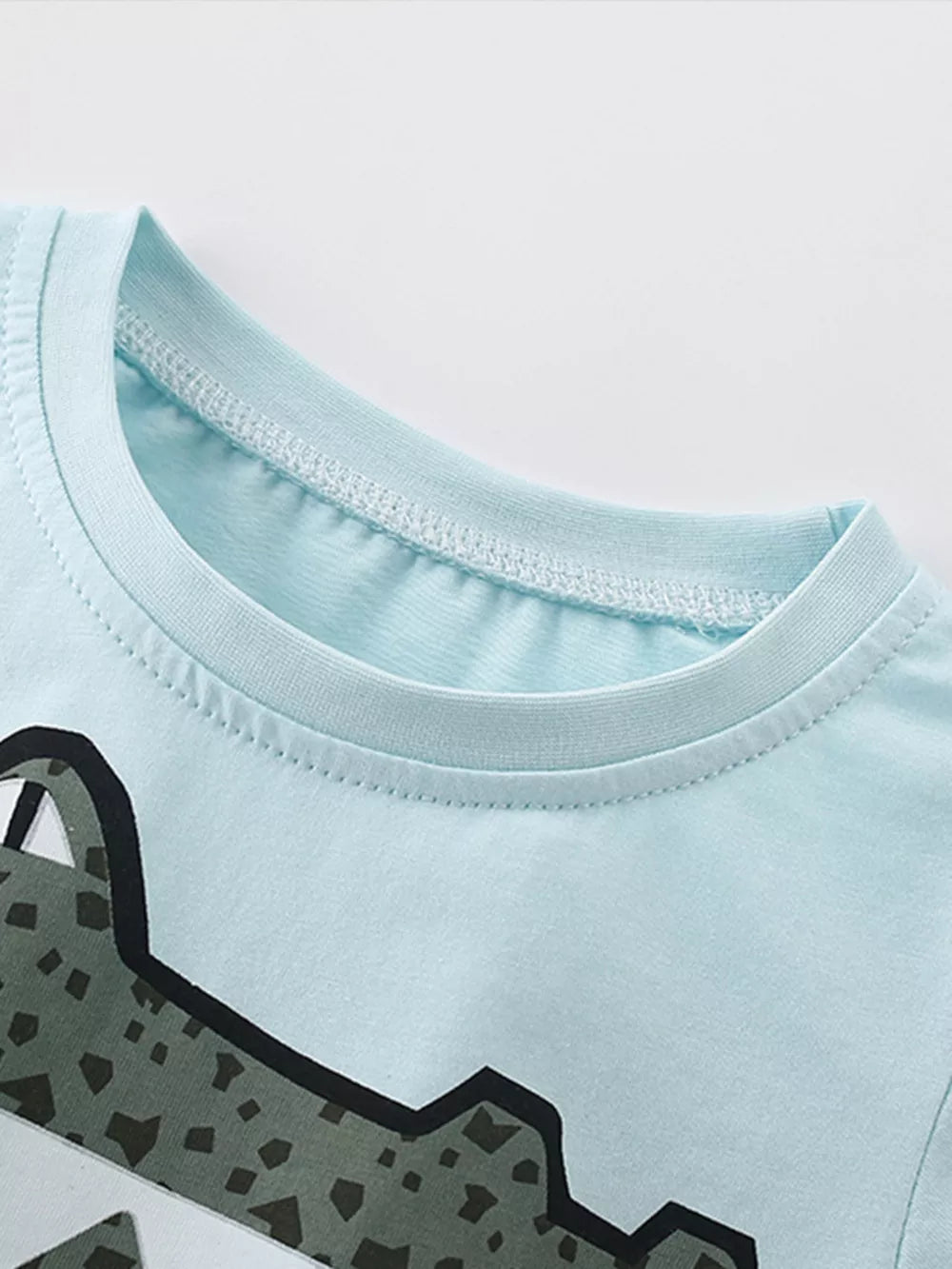 Light blue cotton toddler tee with a crocodile graphic and crew neck.