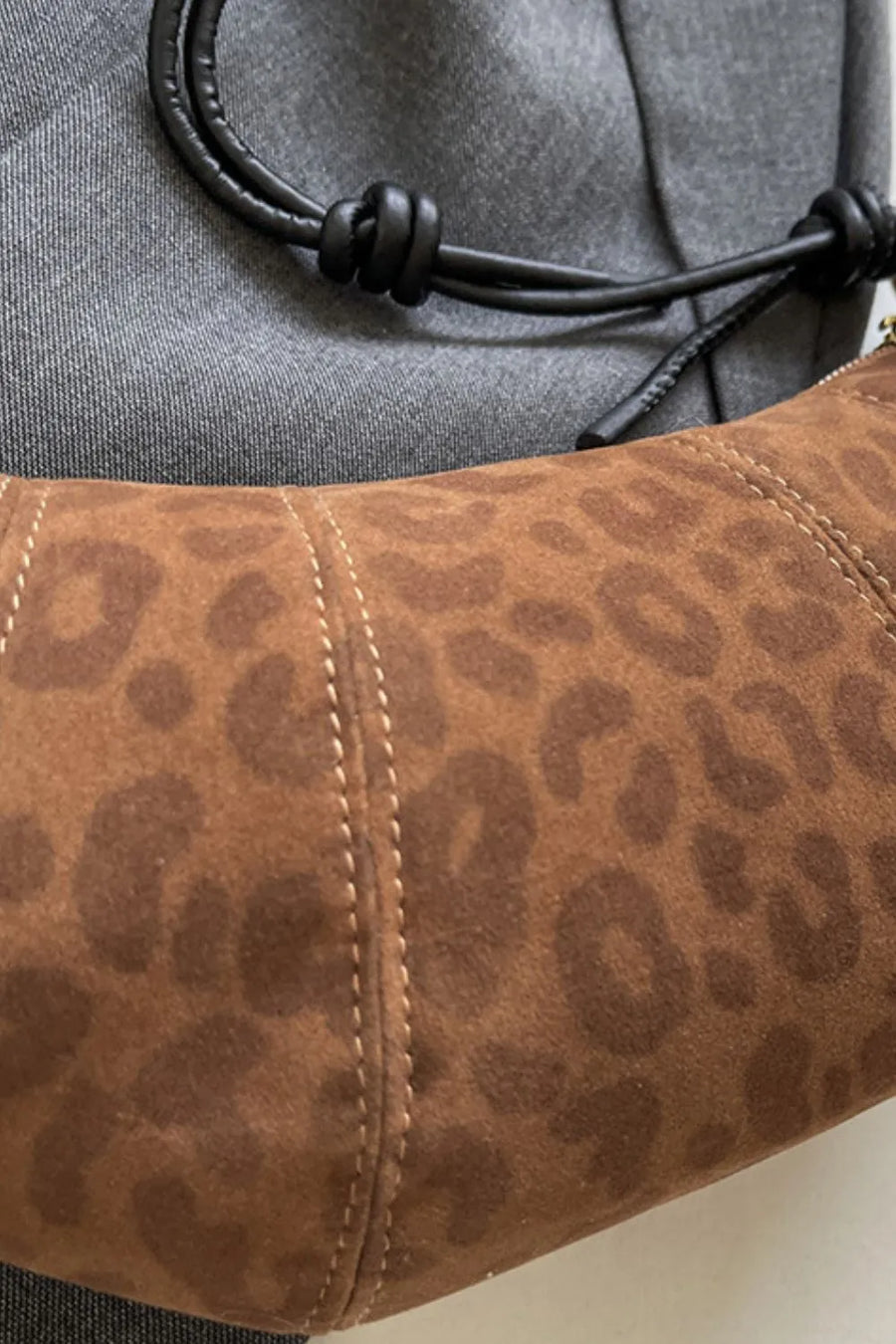 Brown leopard print crescent shoulder bag with knot detail strap