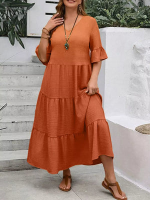 Orange tiered midi dress with ruffle sleeves and crinkled texture