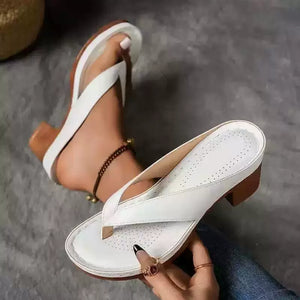 White toe-post block heel sandals with a wooden heel detail.