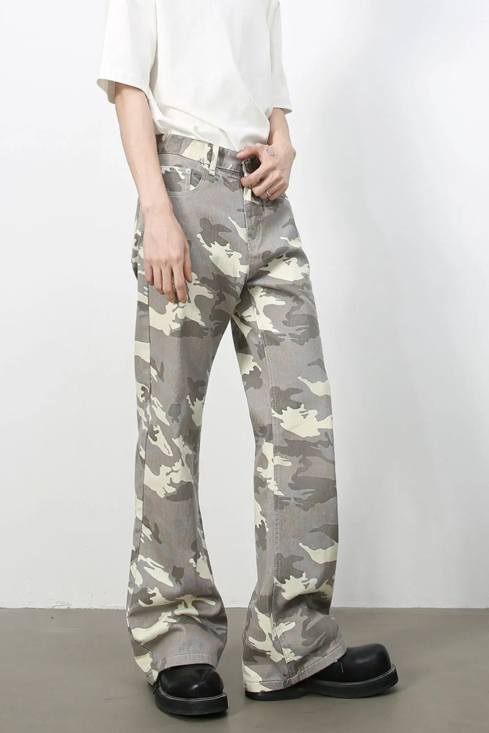 Camouflage flare denim trousers in gray with a relaxed fit.